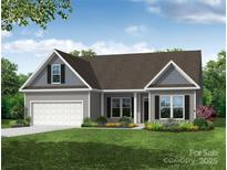 Charming single-story home featuring a two-car garage, a landscaped front yard, and covered entryway at 2252 Tabor Rd # 575, Sherrills Ford, NC 28673