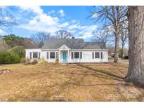 A charming house with a well-maintained lawn and a new roof at 609 Eddleman Rd, Kannapolis, NC 28083