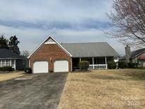 Charming one-story home with a two-car garage and inviting front porch at 6319 Martin Lake Rd, Charlotte, NC 28227