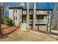 Charming two-story home featuring a welcoming front porch, neutral siding, and well-maintained landscaping at 11 Woodvine Ln, Clover, SC 29710