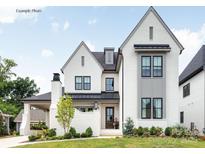 Stunning two-story home with a manicured lawn, elegant white brick, and refined modern design at 19110 Newburg Hill Rd, Davidson, NC 28036
