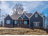 Beautiful two-story house with a well-designed exterior and a spacious front yard at 1022 Harrogate Dr, Bessemer City, NC 28016