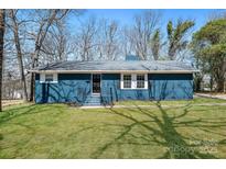 Charming blue brick single-story home with a well-maintained front yard and inviting entrance at 4931 Galax Dr, Charlotte, NC 28213