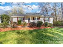 Charming single-story home with manicured lawn and inviting front porch, a perfect cozy retreat at 1025 Hunter Valley Rd, Shelby, NC 28150