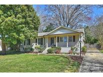 Charming one-story home with a well-manicured front lawn and inviting front porch at 1522 Barberry Ct, Charlotte, NC 28211