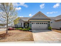 Charming home with a well-manicured lawn, two-car garage, and beautiful curb appeal at 2359 Currant St, Fort Mill, SC 29715