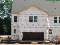 New construction home with a two-car garage, visible windows, and DRB Home wrap at 4127 Walking Ridge Rd # 53, Charlotte, NC 28208