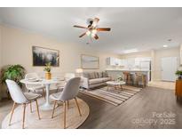 Bright living and dining area featuring an open floor plan with stylish furnishings and decor at 8617 Coralbell Ln, Charlotte, NC 28213