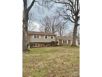 Charming two-story home boasts a manicured lawn and a welcoming front entrance and well-kept landscaping at 809 E 23Rd Street St, Newton, NC 28658
