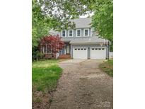 Charming two-story home features a two-car garage, front yard, and inviting curb appeal at 9423 Fairmead Dr, Charlotte, NC 28269