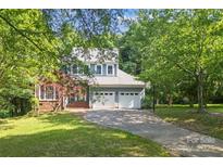 Charming two-story home with a well-manicured lawn and a two-car garage at 9423 Fairmead Dr, Charlotte, NC 28269