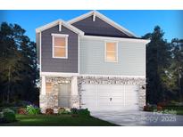 Charming two-story home featuring stone accents, neutral siding, manicured lawn, and a two car garage at 1361 31St Ne St, Conover, NC 28613