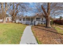 Charming home featuring a covered front porch, walkway, and nicely maintained front yard at 2418 Acapulco Dr, Gastonia, NC 28054
