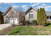 Charming brick home with a well-manicured front yard and attached two-car garage at 151 Birkdale Dr, Salisbury, NC 28144