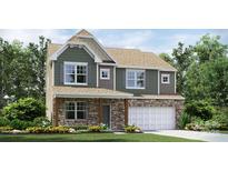 New two-story home featuring stone accents, an attached two-car garage, and a landscaped front yard at 1766 Loggerhead Dr, Lancaster, SC 29720