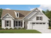 Charming single Gathering home with a two-car garage and beautiful landscaping at 6026 Gray Shadow Ct, York, SC 29745