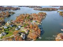 Stunning aerial view of lakefront homes surrounded by colorful autumn trees, offering serene waterfront living and scenic beauty at 226 Hermance Ln, Mooresville, NC 28117