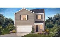 Charming two-story home with gray siding, a two car garage, and a well-manicured front lawn at 586 N Sparkleberry St, Chester, SC 29706