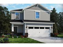 Charming two-story home with a well-manicured lawn and an attached two-car garage at 836 Blue Canyon Dr, York, SC 29745