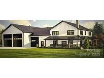 Charming two-story home with a black metal roof, covered porch, and three-bay garage at 109 Winners Cir # 1, Mooresville, NC 28117