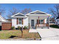 Charming home with a covered porch, complemented by brown shutters and a well-maintained front yard at 1305 Price Ave, Kannapolis, NC 28081