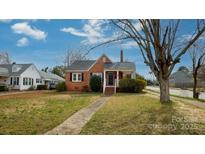 Charming brick home featuring a classic design, inviting entryway, and a well-maintained front yard at 402 Pickens Ct, Rock Hill, SC 29730