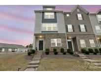 Well maintained exterior facade with brick detail, landscaping and concrete steps at 8260 Waxhaw Hwy, Waxhaw, NC 28173