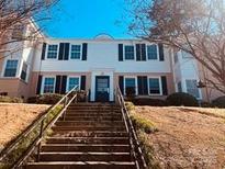 Traditional-style home with manicured landscaping at 565 Wakefield Dr, Charlotte, NC 28209