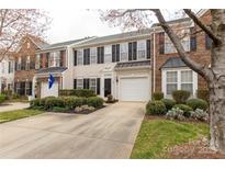 Charming townhome with manicured landscaping, private drive, and attached garage at 187 Snead Rd, Fort Mill, SC 29715