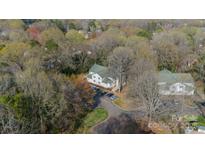 An aerial view of the building with parking, surrounded by trees at 1001 Churchill Downs Ct # A, Charlotte, NC 28211