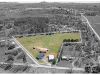 Expansive land with approximate lot lines, outbuildings, and mature trees, perfect for a private estate at 114 Tr Foster Rd, Kings Mountain, NC 28086