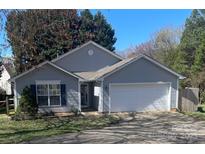 Charming single story home with a two-car garage and landscaped front yard at 127 Creston Ct, Mooresville, NC 28115