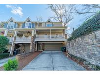 Charming two-story home with a welcoming front porch and attached garage at 2953 Craftsman Ln, Charlotte, NC 28204