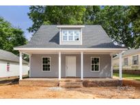 Charming single-story home with inviting front porch, gray siding, and dormer window at 341 Bynum Ave, Rock Hill, SC 29732