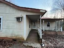 Exterior of a home with an inviting covered porch and a walkway leading to the front door at 2124 Shoal Rd, Lincolnton, NC 28092