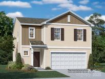 Charming two-story home with neutral siding, a two-car garage, and manicured landscaping at 2946 Legacy Ridge Ln, Catawba, NC 28609