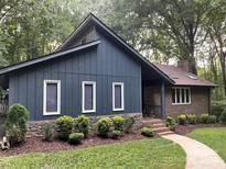 Charming single-Gathering house with a brick foundation, beautiful yard and stone accents at 5434 Beckhaven Ln, Charlotte, NC 28216