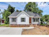 Charming single-story home featuring gray and white siding, stylish windows, and a well-manicured front yard at 914 Saluda St, Rock Hill, SC 29730