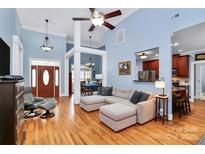 Open-concept living room with hardwood floors, recessed lighting, and a comfortable sectional sofa at 1674 Wakefield Way, Rock Hill, SC 29730