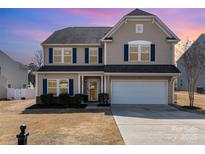 Charming two-story home featuring a two-car garage, blue shutters, and well-maintained landscaping at 532 Dalkeith Ave, Rock Hill, SC 29732