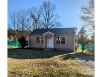 Charming single-story home featuring neutral siding, a well-maintained lawn, and a welcoming front entrance at 1216 Center St, Wadesboro, NC 28170