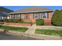 Charming brick home with manicured landscaping and decorative shutters at 3913 Sages Ave, Indian Trail, NC 28079