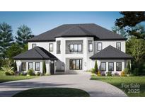 Elegant two-story home showcasing a modern design, with a spacious driveway and meticulously landscaped front yard at 2101 Sharon Ave, Charlotte, NC 28211