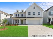 Charming two-story home boasts a modern design, landscaped yard, and attached two-car garage at 2308 Bulwarks Ct # 8P, Albemarle, NC 28001