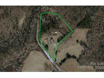 An aerial view of a property with a house on a wooded lot, bordered by S & W Farm Rd at 2320 S And W Farm Rd, Hickory, NC 28602