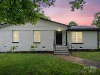 Charming single-story brick home with a well-manicured lawn and freshly painted exterior at 5316 Rupert Ln, Charlotte, NC 28215