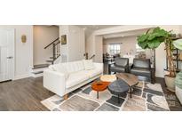 Inviting living room with modern furnishings, stylish rug, and staircase at 108 Helm Ln # B, Mooresville, NC 28117