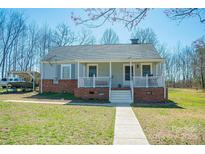 Charming single-story home featuring a welcoming front porch and well-maintained lawn at 1350 Hulls Grove Church Rd, Vale, NC 28168