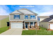 Charming two-story home featuring stone accents, a two-car garage, and inviting front porch at 8051 Plymouth Dr, Sherrills Ford, NC 28673