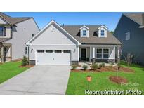 Charming single-Gathering home features a manicured lawn, a two-car garage, and a welcoming front porch at 810 Gondola Ct # 136P, Salisbury, NC 28144